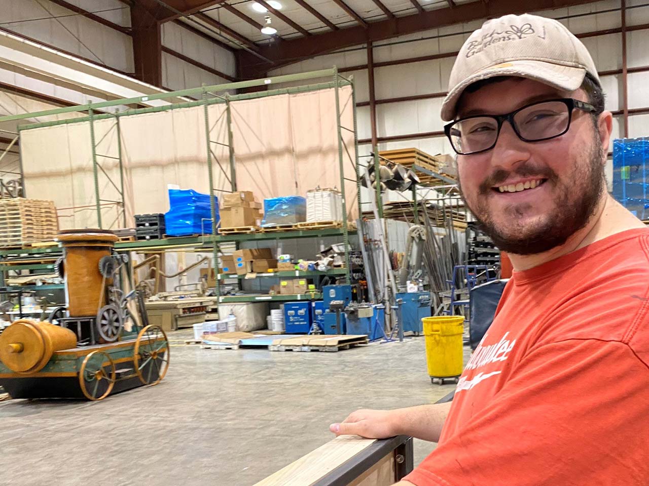 Isaac smiling in the Scenic Solutions production facility