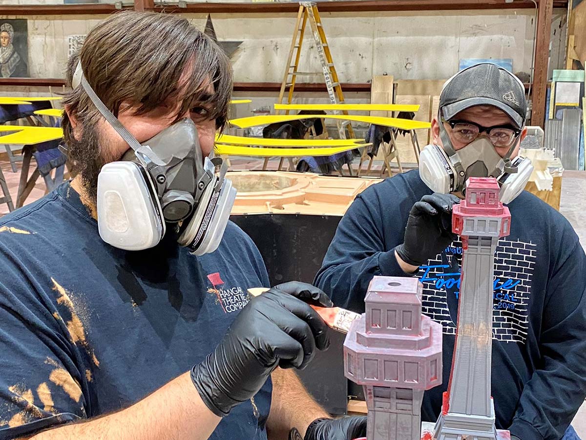 Aurelio and Nelson painting model buildings